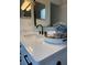 Bathroom vanity with white quartz countertop, black faucet, and neutral accessories at 2049 Crosscreek Ct, Oviedo, FL 32766