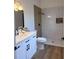 Bathroom featuring a modern vanity with black fixtures and marble tile shower at 2049 Crosscreek Ct, Oviedo, FL 32766