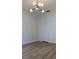 Bedroom featuring laminate floors, and a modern ceiling light fixture at 2049 Crosscreek Ct, Oviedo, FL 32766