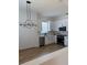 Modern kitchen featuring white cabinets, stainless steel appliances, and wood flooring at 2049 Crosscreek Ct, Oviedo, FL 32766