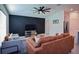 Comfortable living room with a modern accent wall, stylish furnishings, and plenty of natural light for a welcoming atmosphere at 214 Brave Rd, Davenport, FL 33837