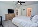 Bright bedroom with a view to the ensuite bath and modern decor, creating a comfortable and stylish space at 214 Brave Rd, Davenport, FL 33837