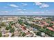 Aerial view shows the neighborhood location with nearby commercial and residential developments at 214 Glasgow Ct, Davenport, FL 33897
