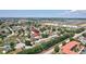 Aerial view of a residential area showcasing the neighborhood and surrounding landscape at 214 Glasgow Ct, Davenport, FL 33897
