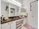 Bathroom with vanity, large mirror, and stylish lighting fixtures at 214 Glasgow Ct, Davenport, FL 33897