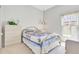 Cozy bedroom with carpet, natural light, and vintage-inspired decor at 214 Glasgow Ct, Davenport, FL 33897
