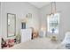 Bright bedroom with carpet, closet, and light-colored furnishings at 214 Glasgow Ct, Davenport, FL 33897