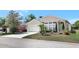 Inviting single-Gathering home with a tidy front lawn and a convenient two-car garage at 214 Glasgow Ct, Davenport, FL 33897