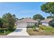 Inviting single-Gathering home with a well-maintained lawn and beautiful landscaping at 214 Glasgow Ct, Davenport, FL 33897