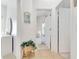 Hallway features neutral flooring and leads to an open bedroom space at 214 Glasgow Ct, Davenport, FL 33897