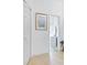 Hallway features neutral flooring and leads to an open bedroom space at 214 Glasgow Ct, Davenport, FL 33897