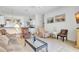 Comfortable living room open to kitchen with tile floors and contemporary furnishings at 214 Glasgow Ct, Davenport, FL 33897