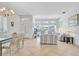 Well-lit living room with tile flooring and ample space for relaxation and entertainment at 214 Glasgow Ct, Davenport, FL 33897