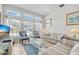 Cozy living room featuring tile floors, plenty of natural light, and comfortable seating at 214 Glasgow Ct, Davenport, FL 33897