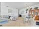 Open-concept living and dining area with tile flooring, ideal for hosting guests at 214 Glasgow Ct, Davenport, FL 33897