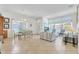Bright living room with tile flooring, and dining area perfect for Gathering gatherings at 214 Glasgow Ct, Davenport, FL 33897
