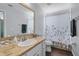 Charming bathroom featuring stylish vanity and a shower with decorative curtain at 2203 Essex Dr, Ocoee, FL 34761