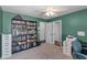 Bedroom featuring a large bookcase filled with books, a printer, and a desk at 2203 Essex Dr, Ocoee, FL 34761