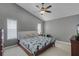 Spacious bedroom with a ceiling fan and two windows provides plenty of natural light at 2203 Essex Dr, Ocoee, FL 34761