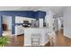 Eat-in kitchen area with breakfast bar and seating features wood floors and modern appliances at 2203 Essex Dr, Ocoee, FL 34761