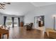 Spacious living room with wood-look tile floors and sliding glass doors to the screened patio at 2203 Essex Dr, Ocoee, FL 34761