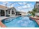 View of the pool and screened-in lanai, showcasing outdoor living at its finest at 2203 Essex Dr, Ocoee, FL 34761