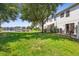 Backyard with well maintained lawn and pond views at 2488 Hassonite St, Kissimmee, FL 34744