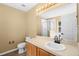 This is a standard bathroom with a shower, vanity, a framed mirror, and tile flooring at 2488 Hassonite St, Kissimmee, FL 34744