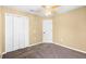 This bedroom features carpeted floors and a large closet at 2488 Hassonite St, Kissimmee, FL 34744