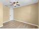 Bedroom with wood floors, ceiling fan, and a neutral color palette at 2488 Hassonite St, Kissimmee, FL 34744