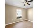 Cozy bedroom with wood floors, a window, and neutral paint at 2488 Hassonite St, Kissimmee, FL 34744