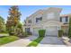 Attractive townhome with attached garages, neatly trimmed landscaping, and a welcoming appearance at 2488 Hassonite St, Kissimmee, FL 34744