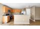 Bright kitchen featuring stainless steel appliances, granite countertops, and wooden cabinets at 2488 Hassonite St, Kissimmee, FL 34744