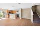 Open kitchen and living area featuring wood floors, stainless steel appliances, and outdoor access at 2488 Hassonite St, Kissimmee, FL 34744
