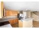 Kitchen showcasing granite countertops, stainless steel refrigerator, and wooden cabinets at 2488 Hassonite St, Kissimmee, FL 34744