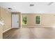 Living room featuring plenty of natural light and wood laminate flooring at 2488 Hassonite St, Kissimmee, FL 34744