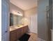 Bathroom featuring dual sinks, vanity, and separate shower and tub at 2585 Woodside Ridge Dr, Apopka, FL 32712