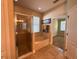 Bright bathroom featuring a shower, tub, and window bringing in light at 2585 Woodside Ridge Dr, Apopka, FL 32712