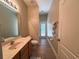 Bathroom with vanity, tile floor, and access to outside patio at 2585 Woodside Ridge Dr, Apopka, FL 32712
