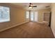 Spacious bedroom with carpet, natural light and access to a private balcony at 2585 Woodside Ridge Dr, Apopka, FL 32712