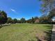 Expansive green space in a vibrant community featuring mature trees and a charming gazebo at 2585 Woodside Ridge Dr, Apopka, FL 32712