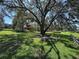 Scenic park view featuring a large shade tree and a charming gazebo for community gatherings at 2585 Woodside Ridge Dr, Apopka, FL 32712