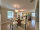 Inviting dining area featuring modern lighting and a round glass table at 2585 Woodside Ridge Dr, Apopka, FL 32712