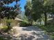 Paver driveway to home with lush, mature landscaping at 2585 Woodside Ridge Dr, Apopka, FL 32712