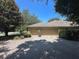 Attached three-car garage with paver driveway and lush landscaping at 2585 Woodside Ridge Dr, Apopka, FL 32712