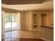 Bright living room features tile flooring, sliding glass doors to the backyard, and neutral paint at 2585 Woodside Ridge Dr, Apopka, FL 32712