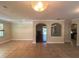Spacious living room with tile flooring and arched openings to other rooms at 2585 Woodside Ridge Dr, Apopka, FL 32712