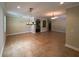 Large living area with neutral walls, tile floors, and decorative light fixtures at 2585 Woodside Ridge Dr, Apopka, FL 32712