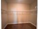 Spacious walk-in closet featuring carpeted floors and multiple wire shelves for efficient storage solutions at 2585 Woodside Ridge Dr, Apopka, FL 32712