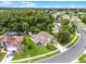 Aerial view of community with mature trees and a pond at 2888 Middleton Cir, Kissimmee, FL 34743
